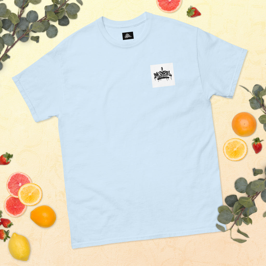 Light blue t-shirt with a logo on a yellow background with fruits and leaves