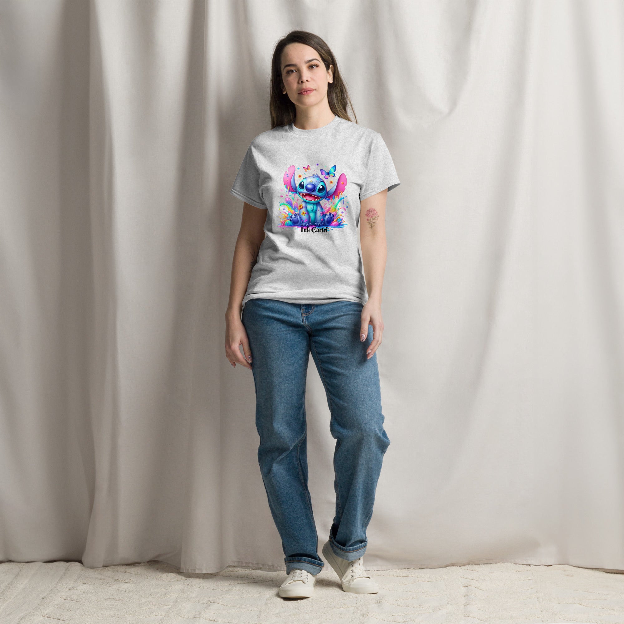  Ink Cartel exclusive streetwear design showing a cartoon-style blue character splashing through dripping black and colorful ink, creating a bold graffiti-inspired visual on a premium t-shirt