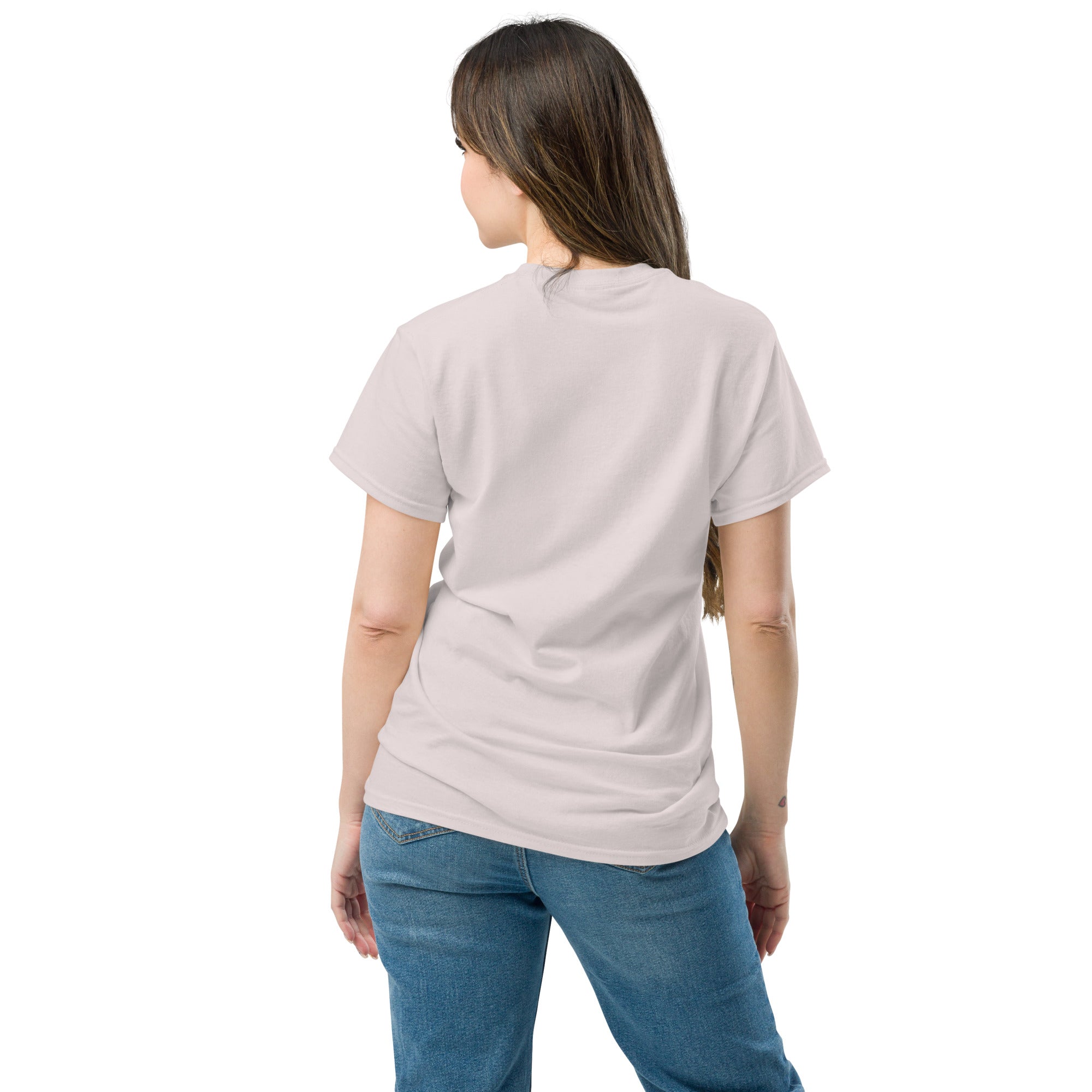 Woman wearing a light gray t-shirt and blue jeans on a white background