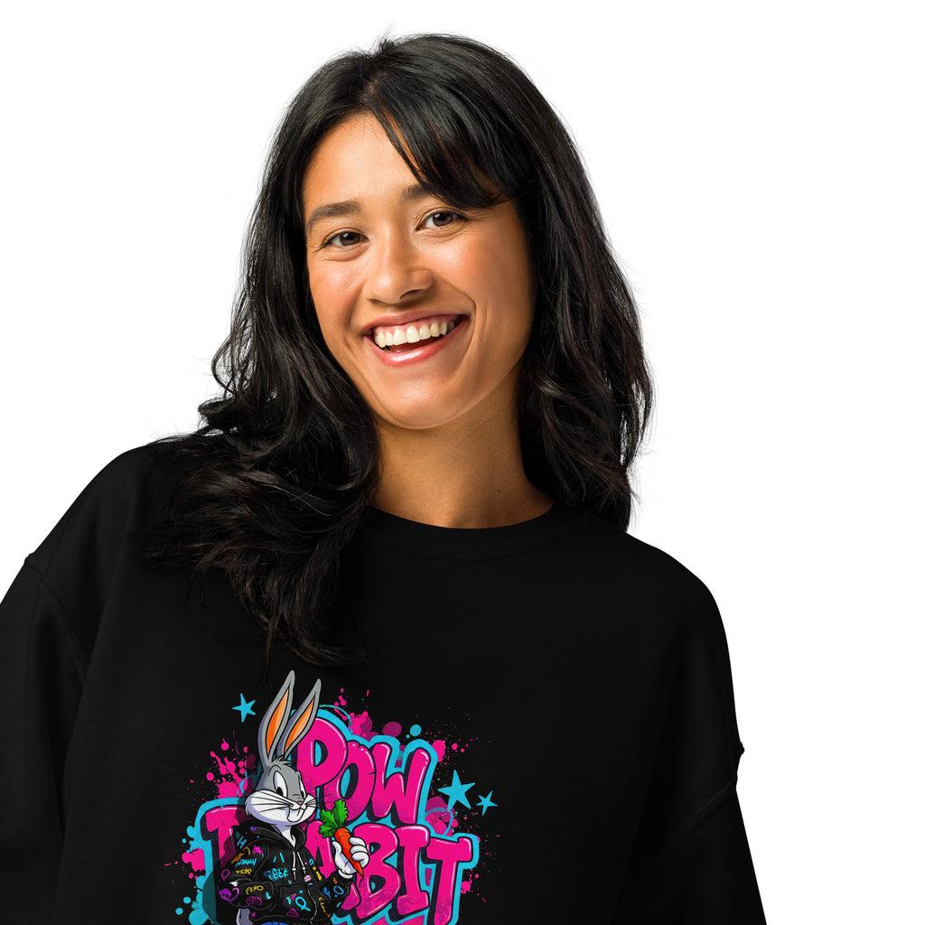 Person wearing a black sweatshirt with a colorful graphic design on a white background