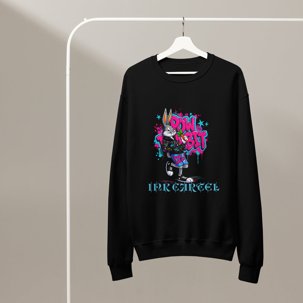 Black sweatshirt with colorful graphic design on a hanger against a beige background