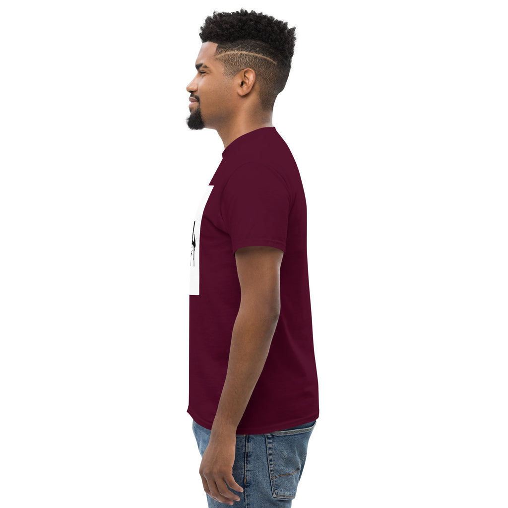 Man wearing a maroon t-shirt with a white graphic on a white background