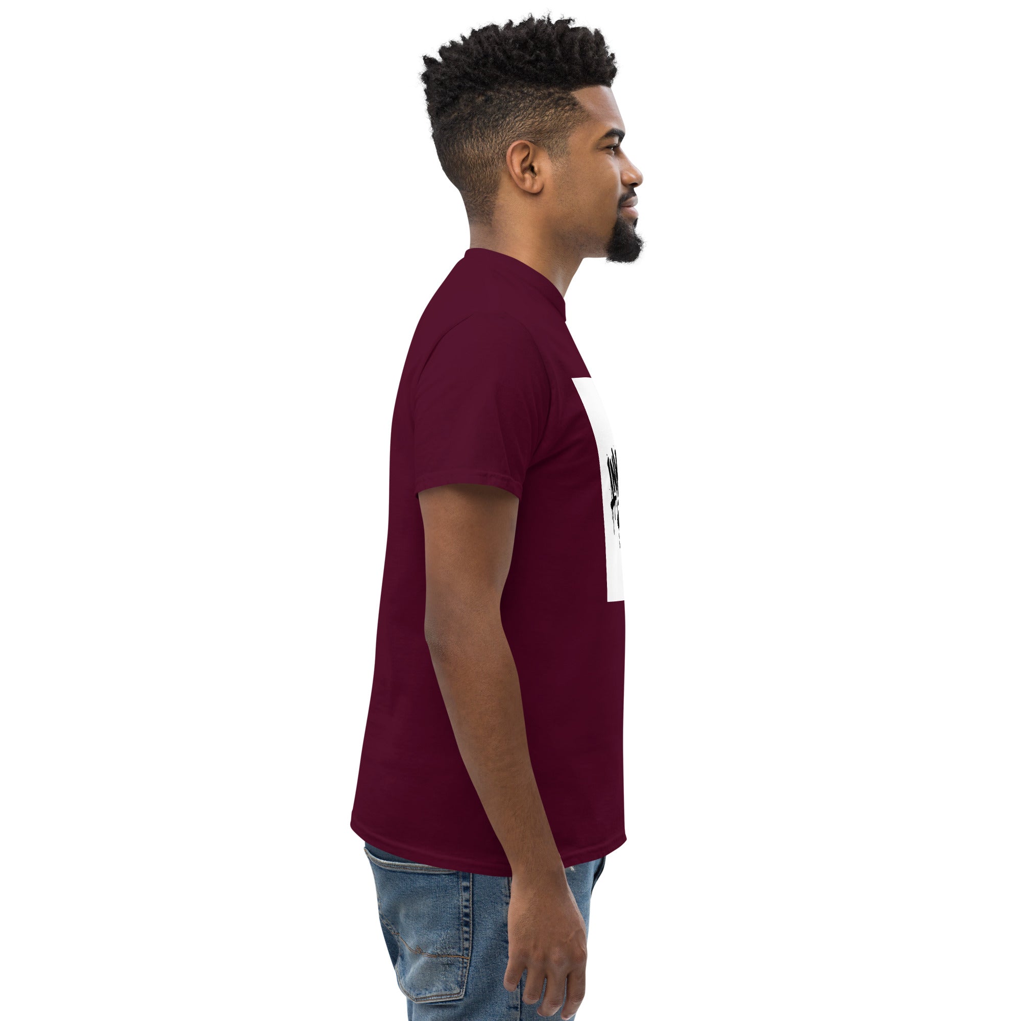 Man wearing a maroon polo shirt with a white graphic on a white background