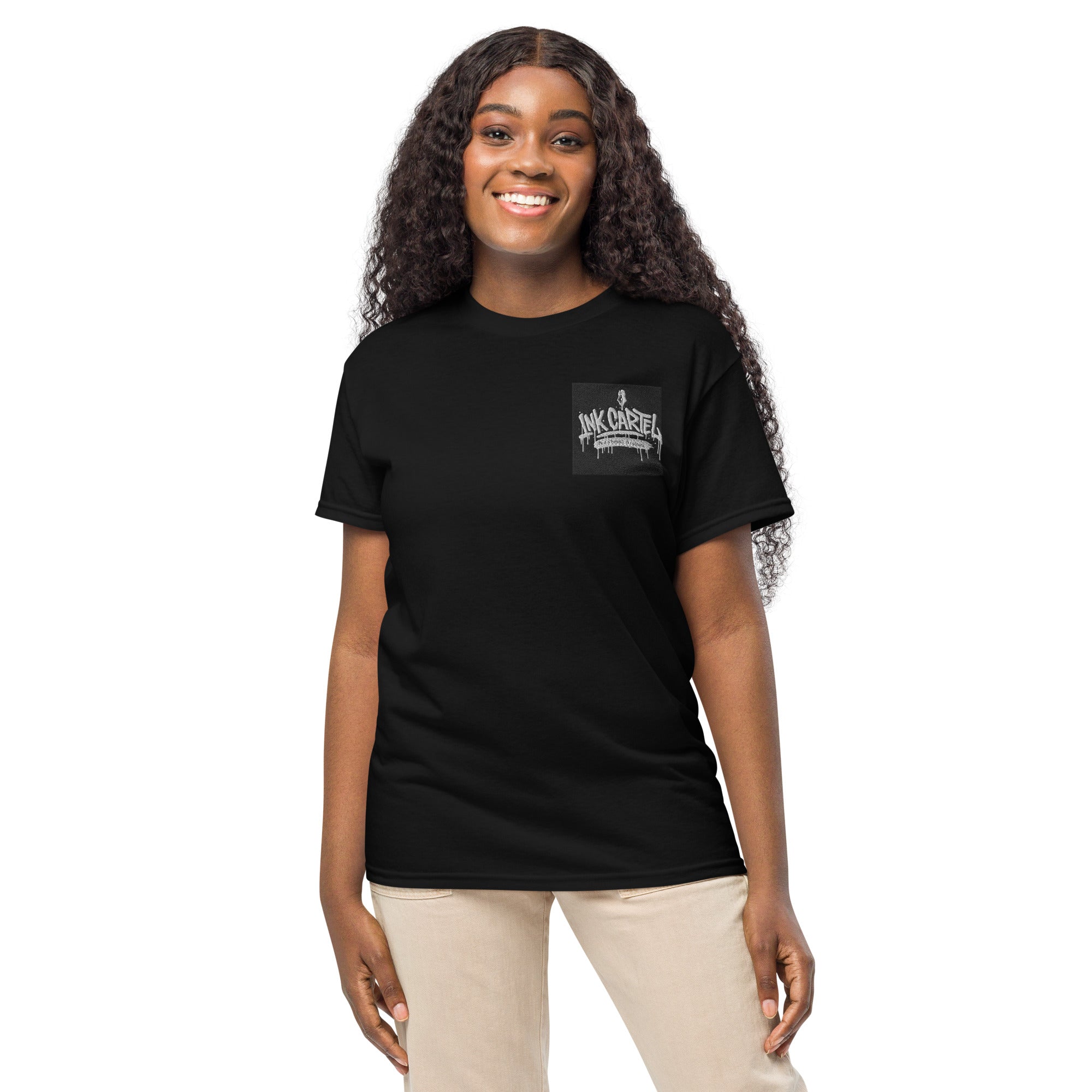 Person wearing a black t-shirt with a logo on a white background